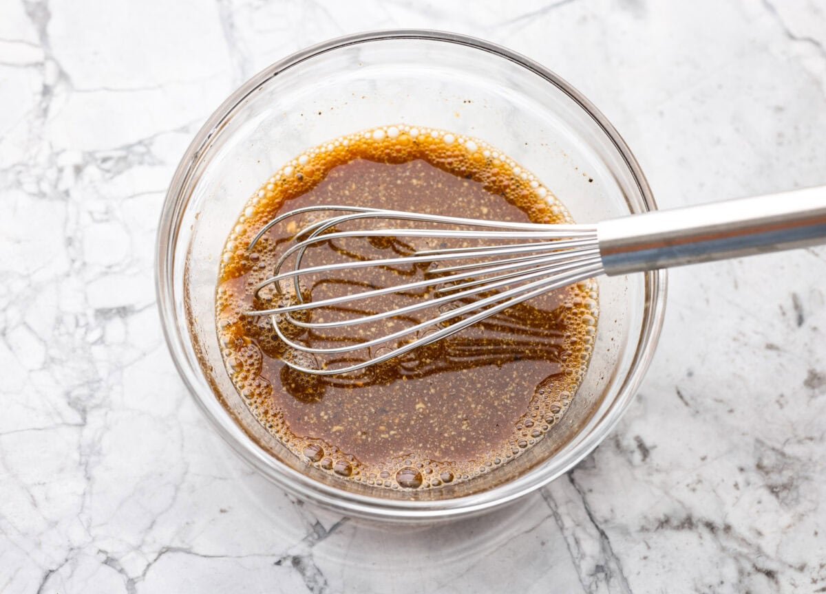 Marinade ingredients whisked together in a bowl.