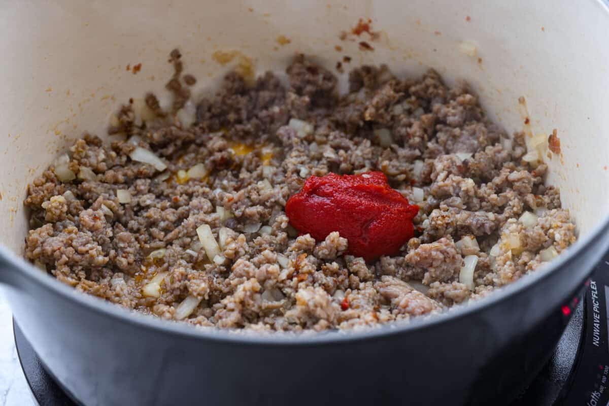 Tomato paste added to the meat mixture.